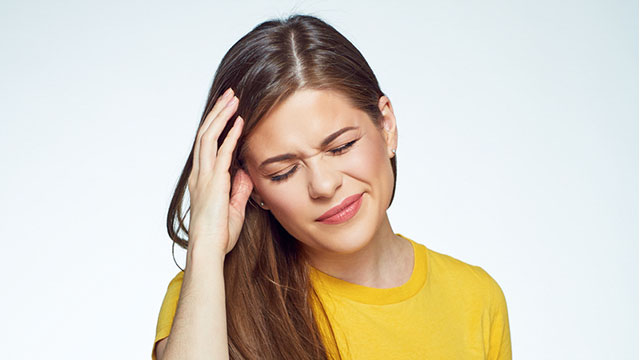 A woman having a headache