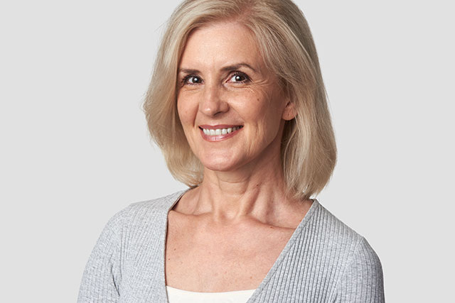 Middle age woman smiling indoors