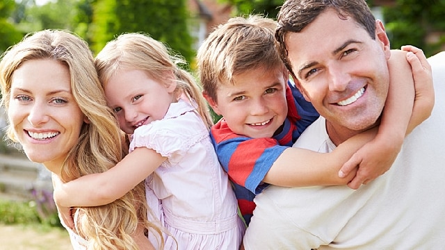 Parents and children are happy together with healthy gums