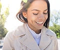 Smiling woman walking outdoors