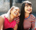 2 girlfriends hanging out smiling