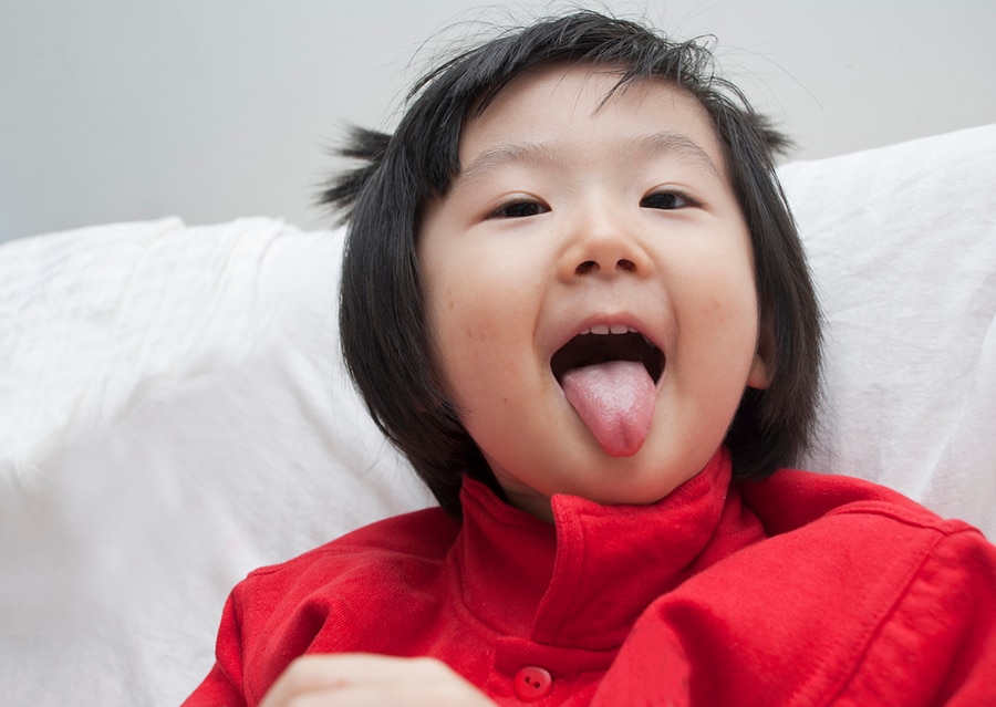 Little girl with tongue out