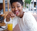 woman drinking orange juice