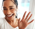 U young woman is stretching her arms and smiling