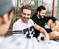 Three men talking