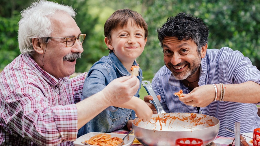 A family enjoying a meal outdoors