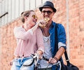 A couple sharing a snack outdoors