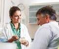 Dentist with patient in dental office