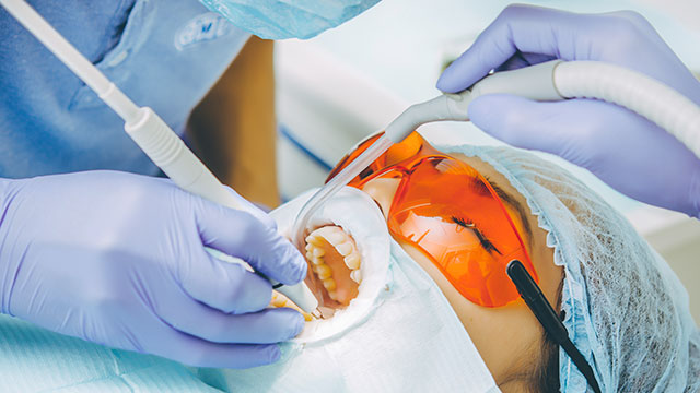A patient receiving a teeth whitening treatment