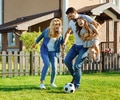 family playing soccer together