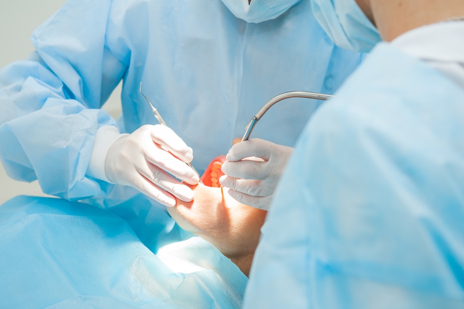 Dentists treating a patient