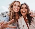 Two young women smiling outdoors