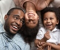 Parents and two kids on the bed