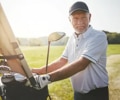 Man golfing after root canal infection treatment