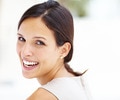 Woman smiling over her shoulder