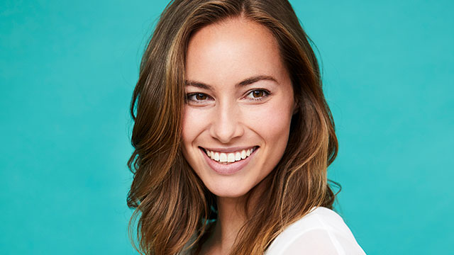 A young woman smiling