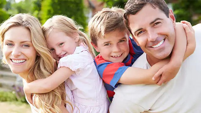 Family Smiling after Using a new Toothpaste