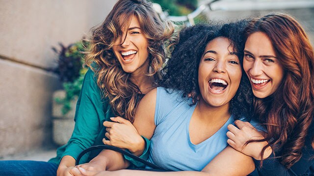 women smiling after teeth whitening