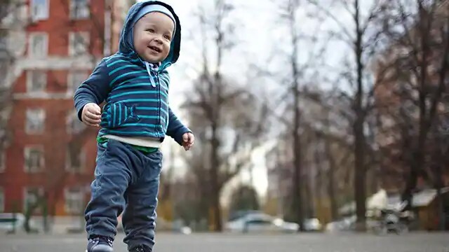 toddler walking in the park