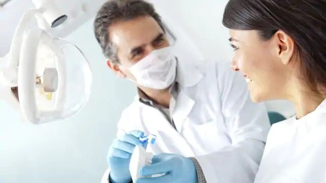 dentist talking with patient about dental sedation