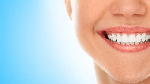 woman smiling after composite resin bonding treatment
