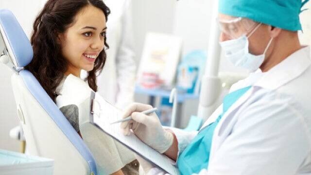 doctor discussing dental anesthesia side effects with patient