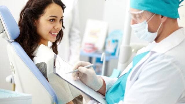 dentist talking with patient about sedation dentistry