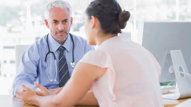 woman discussing sleep apnea with doctor