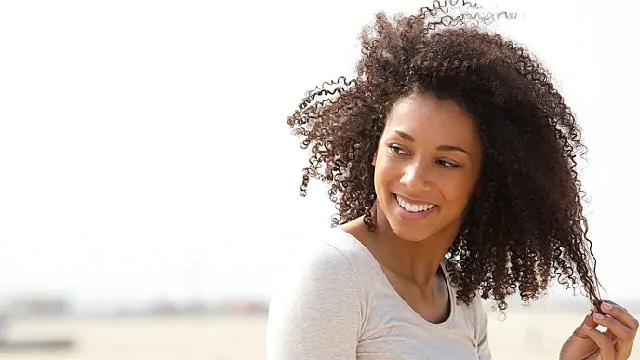 woman with whitened teeth after acid erosion treatment