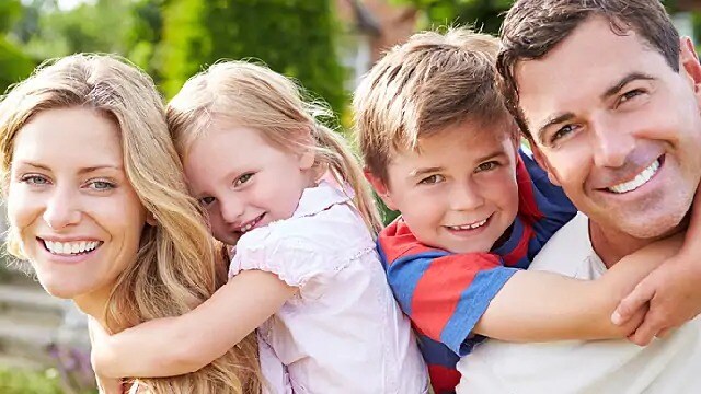 family are happy together after coping with enamel dysplasia