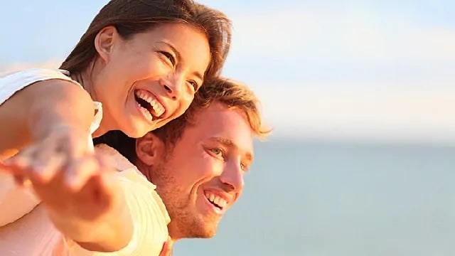 couple smiling after procedure for root canal