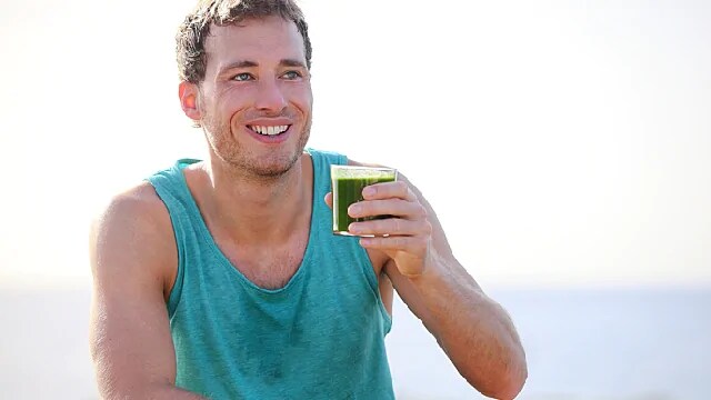 man drinking juice