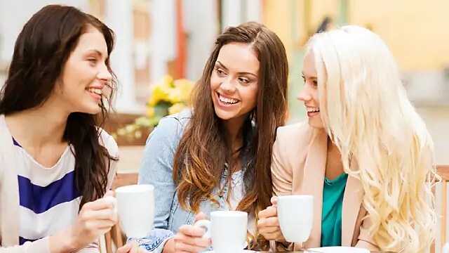 women avoiding drinks that harm teeth