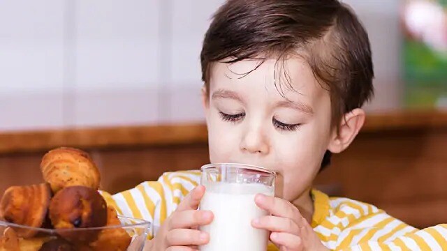 child drinking milk for stronger teeth