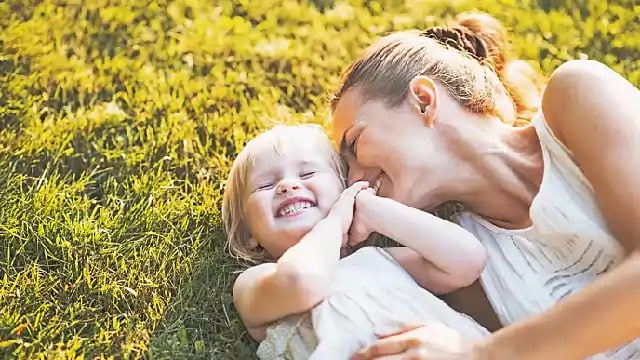 parent & child smiling after flossing