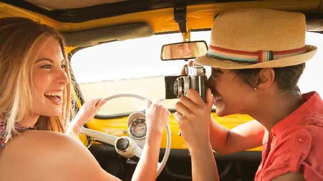 person in car taking a picture