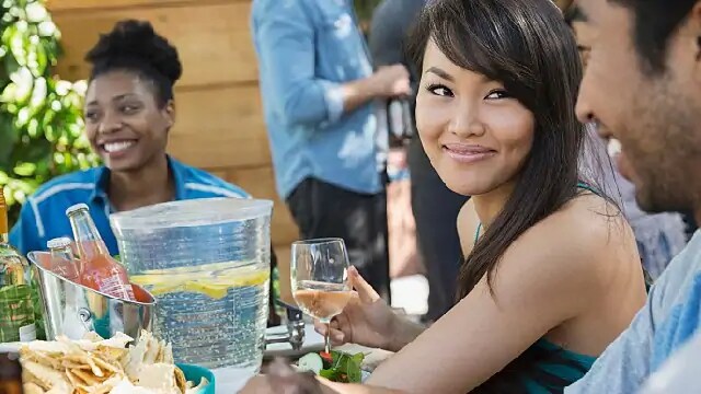 woman drinking water after wisdom tooth removal