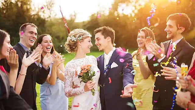 couple smiling at wedding with whitened teeth