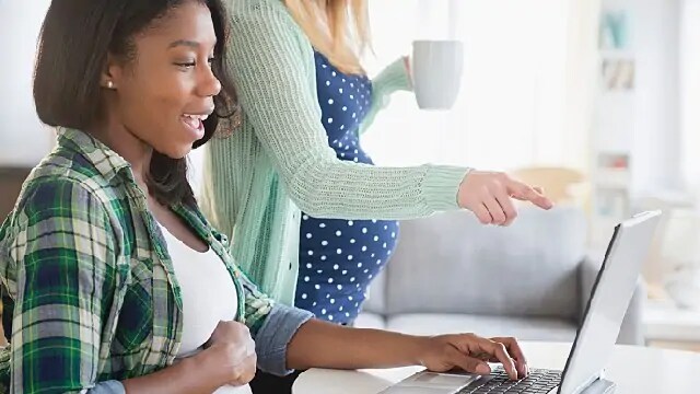 pregnant woman researching teeth cleaning