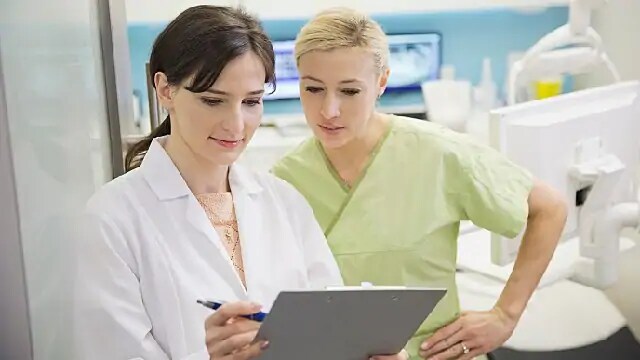 dentists reviewing new technology specs