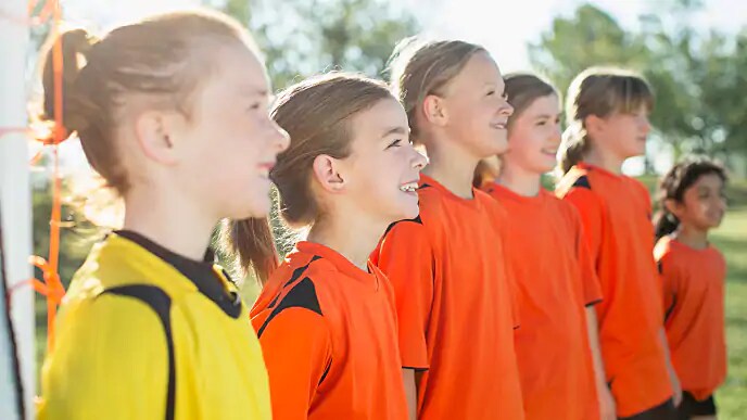 girls smiling before soccer game