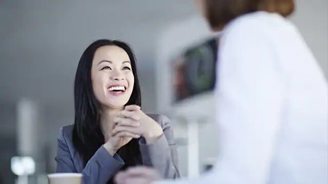 woman discussing teeth whitening strips with dentist