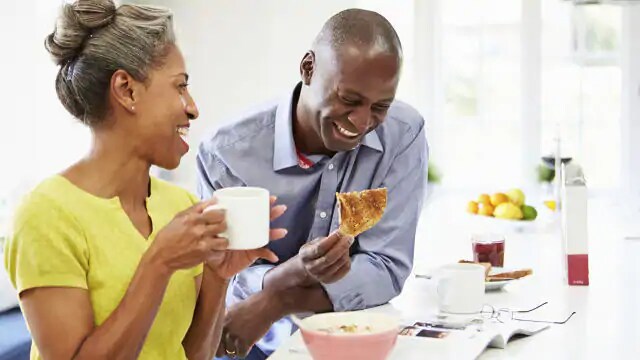 husband and wife eating breakfast