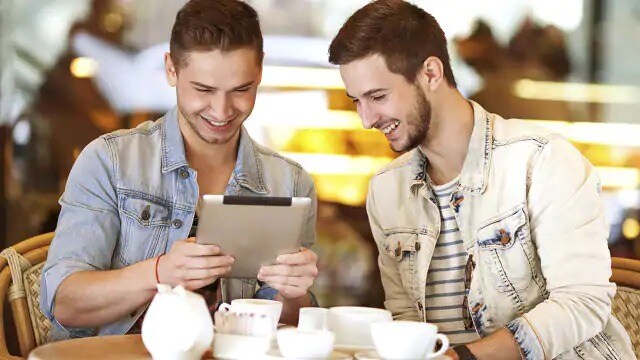 men reading about baking soda for whitening teeth