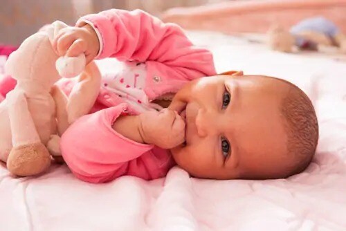 newborn baby smiling
