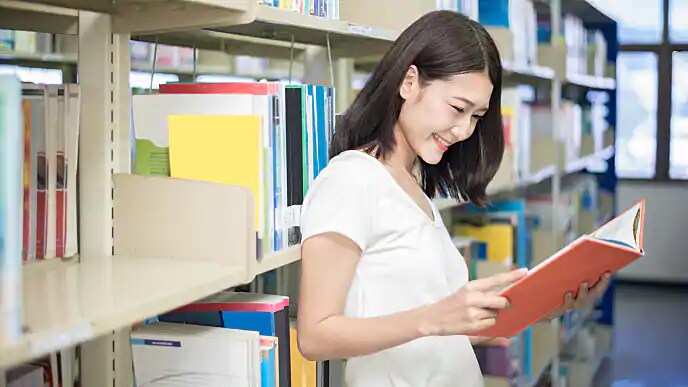 Woman Reading up on Tea Tree Oil Benefits for Teeth