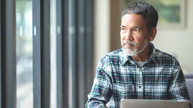 man researching health impacts from bad teeth