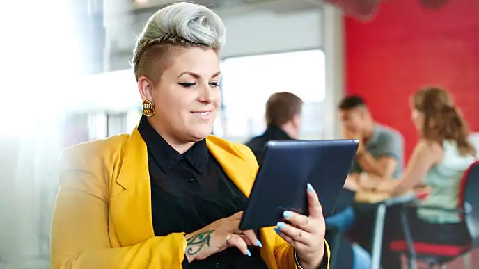 woman reading about tooth piercings