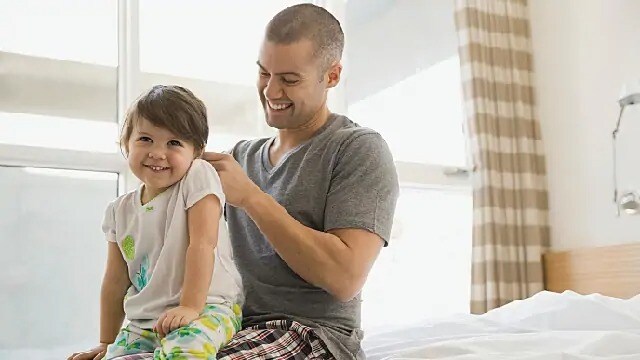 father laughing with child