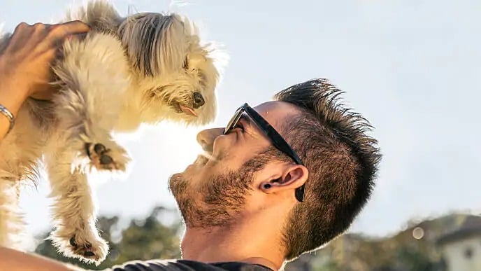 man smiling with dog